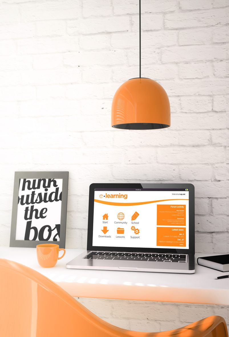 orange desktop with laptop showing e-learning website